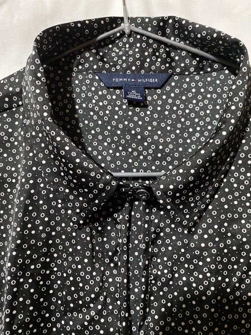 Tommy Hilfiger Sleeveless Blouse - Black with White Polka Dot Pattern (Category: Sleeveless) located in Baguio. Submitted by royalriver17 (Listing ID 1453441539, Image 2). Description: Sleeveless collared blouse by Tommy Hilfiger. Black with white polka dots. Button closure at neck. Small metal logo tag on hem. Perfect for smart casual..