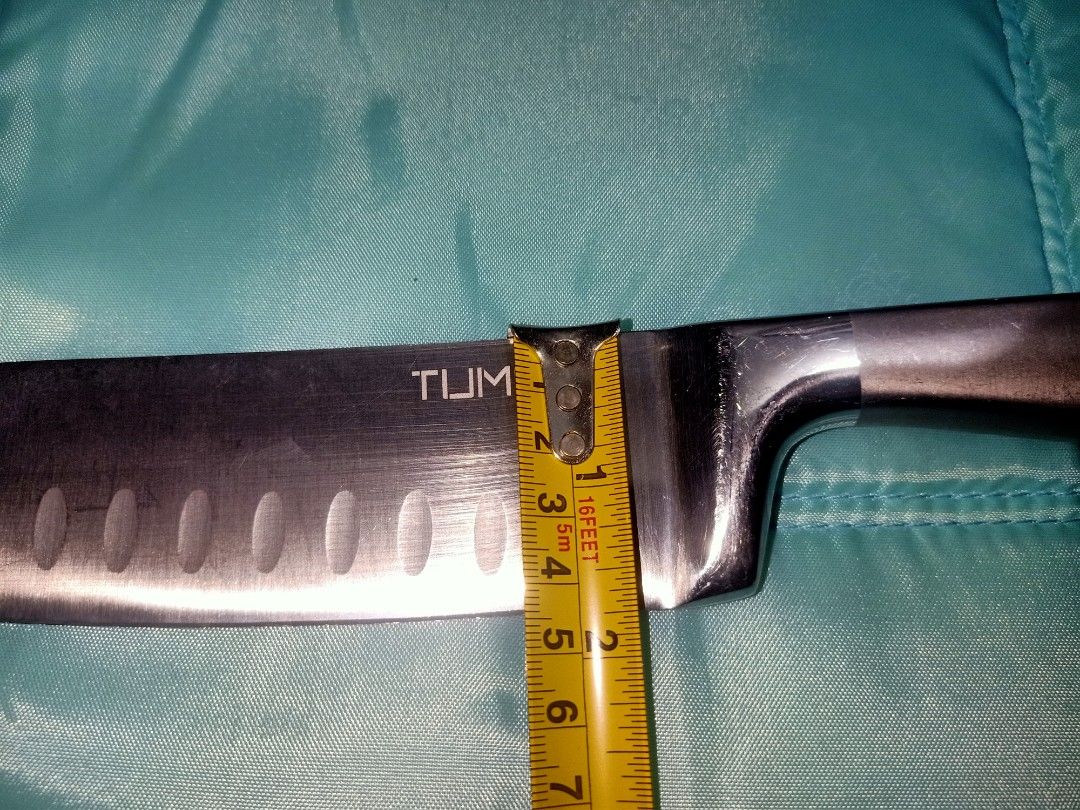 TUM S Santoku Knife with Granton Edge (Category: Knives & Chopping Boards) located in Pasig City. Submitted by urdal01 (Listing ID 1453590846, Image 3). Description: - TUM S. Santoku Knife - 7-inch blade with Granton edge (reduces sticking) - Ergonomic handle for comfortable grip - Ideal for chopping and slicing - Sharp and ready for immediate use.