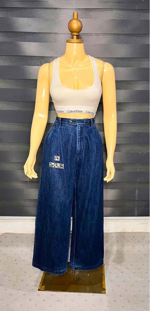 Uniqlo Wide Leg Denim Pants (Category: Jeans) located in Cabanatuan. Submitted by doelly1221 (Listing ID 1453549103, Image 1). Description: - Uniqlo dark wash wide leg denim pants - High waisted with button and zip closure - Front pleats for a stylish look - Subtle patch detail on left leg - Comfortable relaxed fit - Inner waistband features a cute checkered lining.