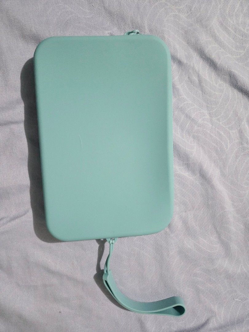 Viajecito clutch (mini)light blue (Category: Luxury Bags & Wallets) located in Quezon City. Submitted by nlbuenaventura (Listing ID 1453597189, Image 2). Description: length: 7" height: 4.4" width: 0.9" flexible silicone material waterproof clutch bag.
