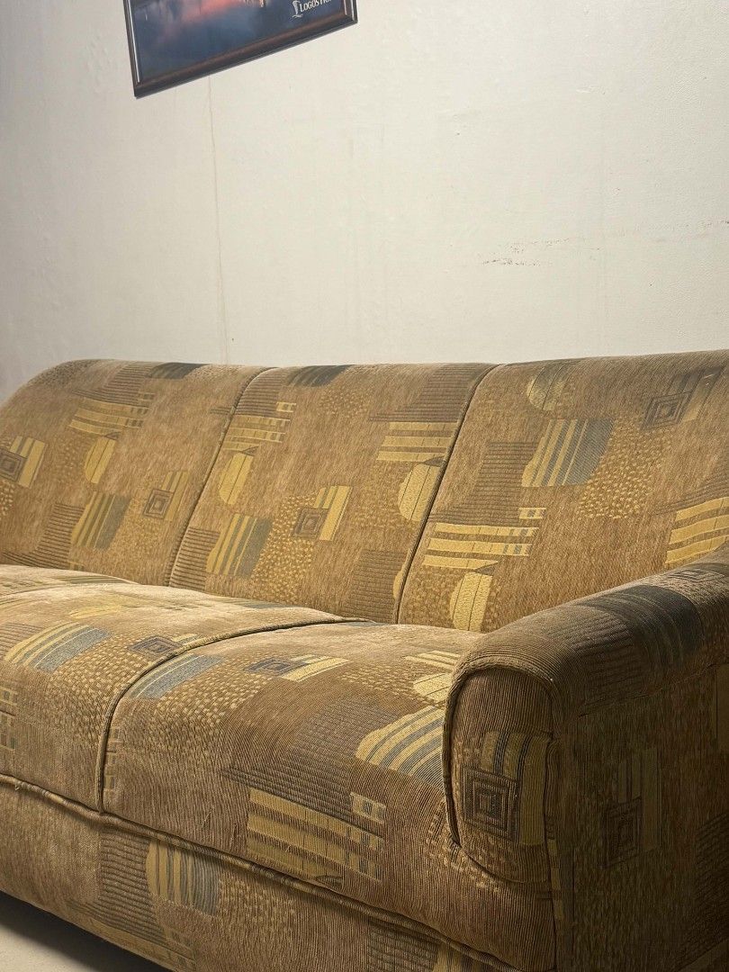 Vintage Geometric Pattern Sofa - 3 Seater (Category: Sofas) located in Manila. Submitted by glengpascu18784 (Listing ID 1453525217, Image 2). Description: - Vintage 3-seater sofa - Unique geometric pattern in brown, yellow, and grey tones - Textured upholstery for a tactile feel - Plush and comfortable cushions - Perfect for living rooms or lounge areas - Shows minor signs of wear consistent with age - Pick up only.