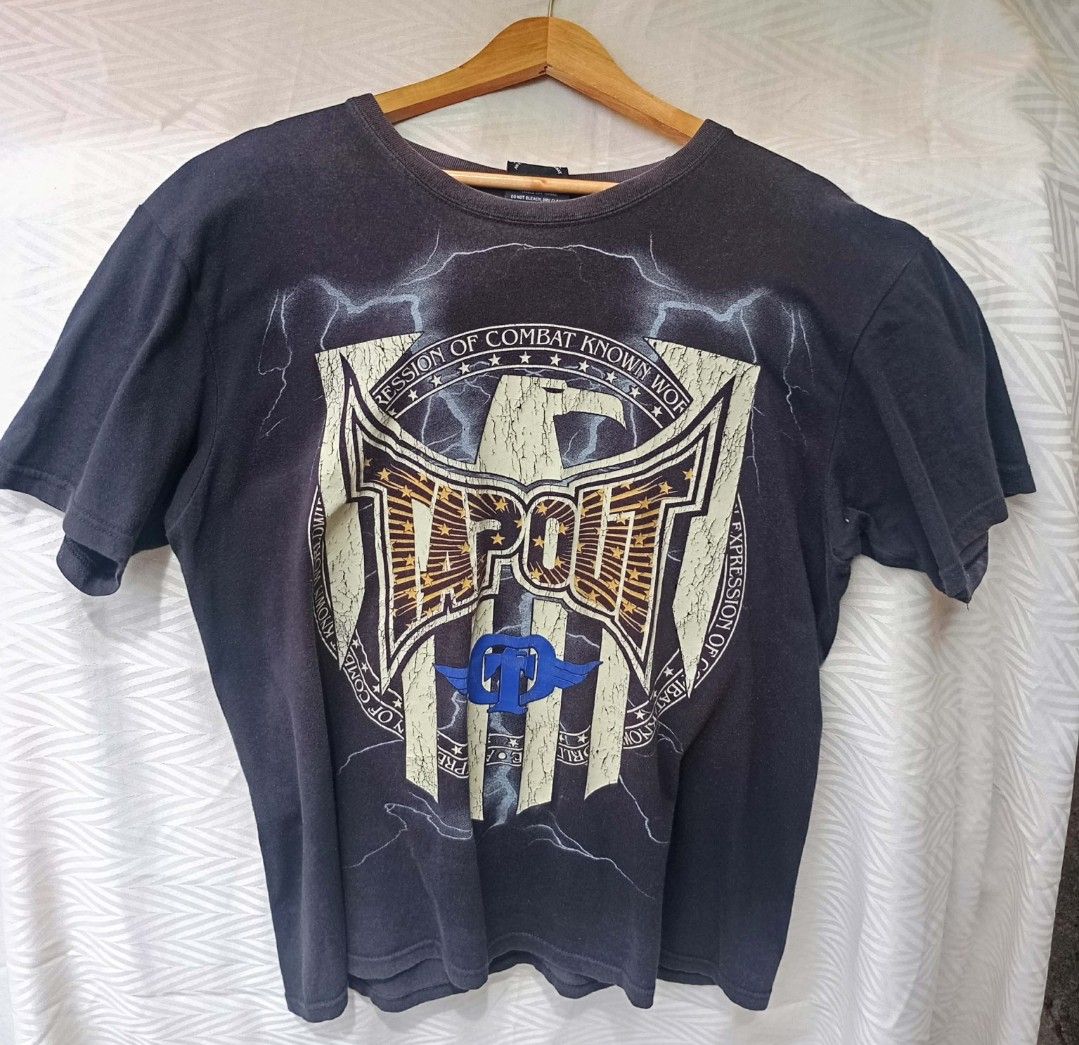 Vintage Tapout "Expression of Combat" Graphic Tee (Category: Tshirts & Polo Shirts ) located in Davao. Submitted by karaangbisti (Listing ID 1453538263, Image 1). Description: Vintage Tapout "Expression of Combat" Graphic Tee Size: XL on tag Width: 22 inches Length: 28 inches Color rate: 8.5/10 Good condition Issue: Multiple pinholes , hairline crack prints.