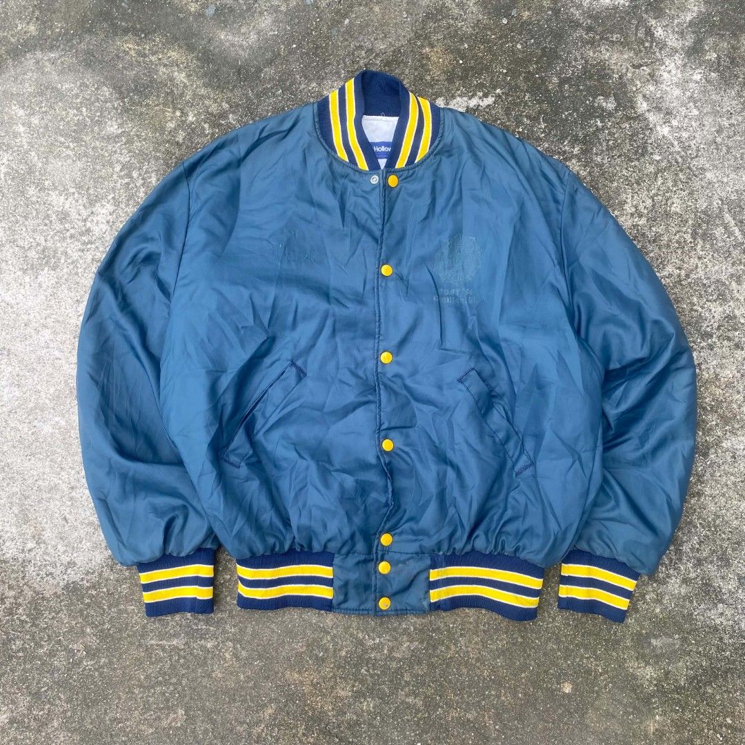Vintage Varsity Jacket with Yellow Accents (Category: Activewear) located in Tanza. Submitted by ThriftPieces (Listing ID 1453519318, Image 1). Description: - Classic varsity jacket - Yellow and navy striped collar and cuffs - Yellow button-up front - Ideal for casual wear - Vintage.