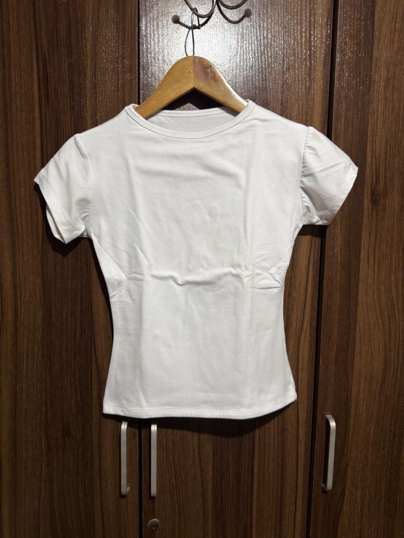 White Basic Top (Category: Shirts) located in Cavite. Submitted by rrppreloved (Listing ID 1453573079, Image 1). Description: Can fit S-SEMI MED.
