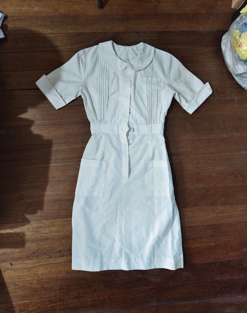 white nurse's uniform dress (Category: Medical Supplies & Tools) located in Bulacan. Submitted by angel.decluttersx (Listing ID 1453462972, Image 1). Description: ww provided (for reference I'm small bodyframe) medium size up to 32" waistline Length 39 inches all buttons are working no issue.