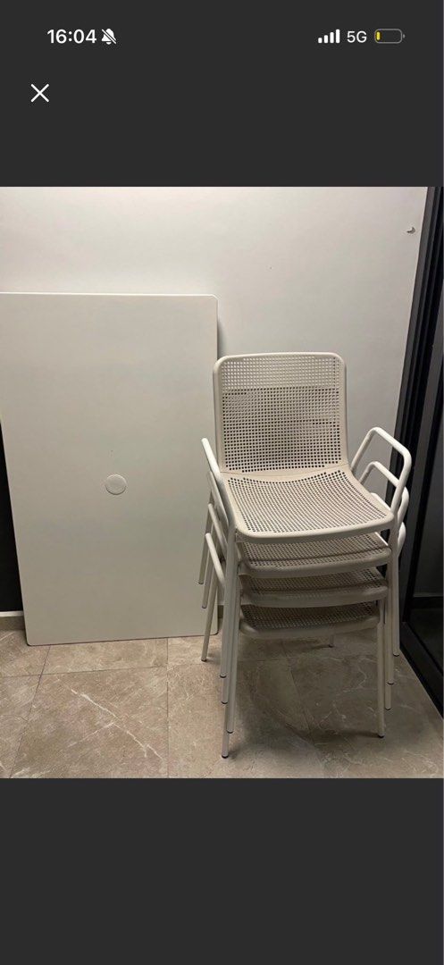 White Rectangular Table with Stackable Chairs (Category: Tables & Sets) located in Singapore. Submitted by emilyroberts23 (Listing ID 1453510014, Image 1). Description: - White rectangular table, foldable - 4 stackable chairs - Versatile for indoor or outdoor use - Sold as a set.