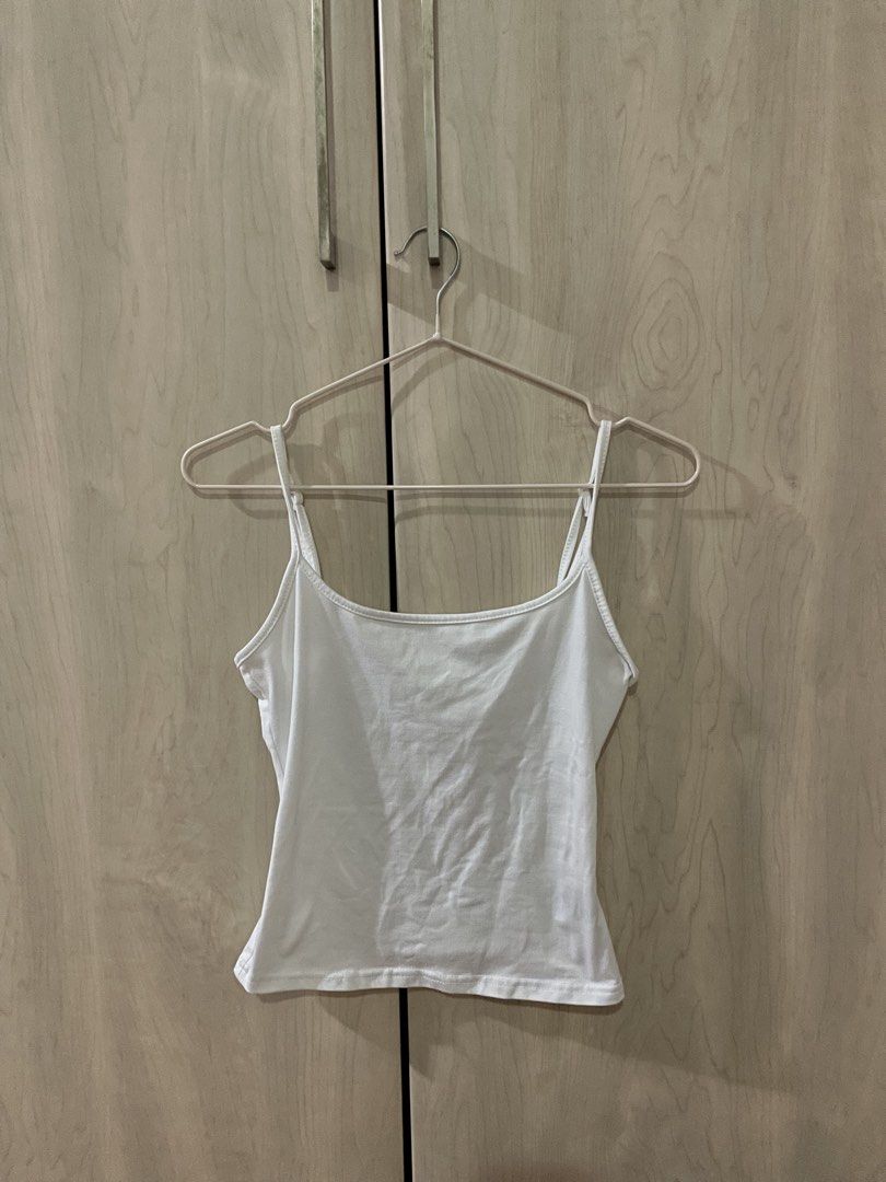 White Spaghetti Strap Sleeveless Camisole Tank Top (Category: Blouses) located in Quezon City. Submitted by snooop (Listing ID 1453615363, Image 3). Description: RFS: declutterring 〰️ fits XS-S frame 〰️ cute & dainty european summer or basic top! 〰️ light and stretchy fabric with adjustable straps 〰️ no flaws.
