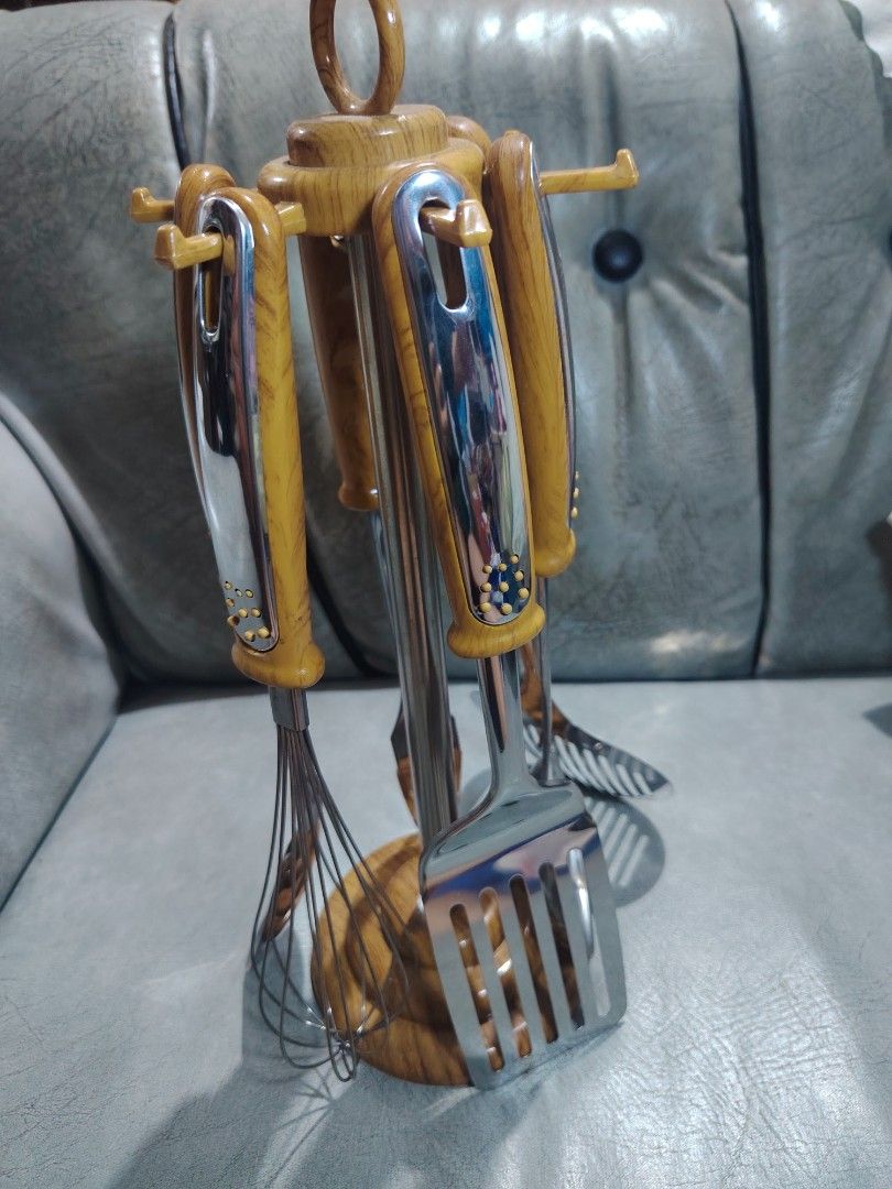 Wooden Handle Kitchen Utensil Set with Stand (Category: Other Kitchenware & Tableware) located in Manila. Submitted by nixwear_it (Listing ID 1453590293, Image 1). Description: - Complete set of kitchen tools with a stylish wooden and chrome finish. - Includes: whisk, ladle, slotted spoon, slotted turner, and carving fork. - All tools hang neatly on the included wooden stand. - Ideal for everyday cooking and baking tasks. - Enhances the look of y