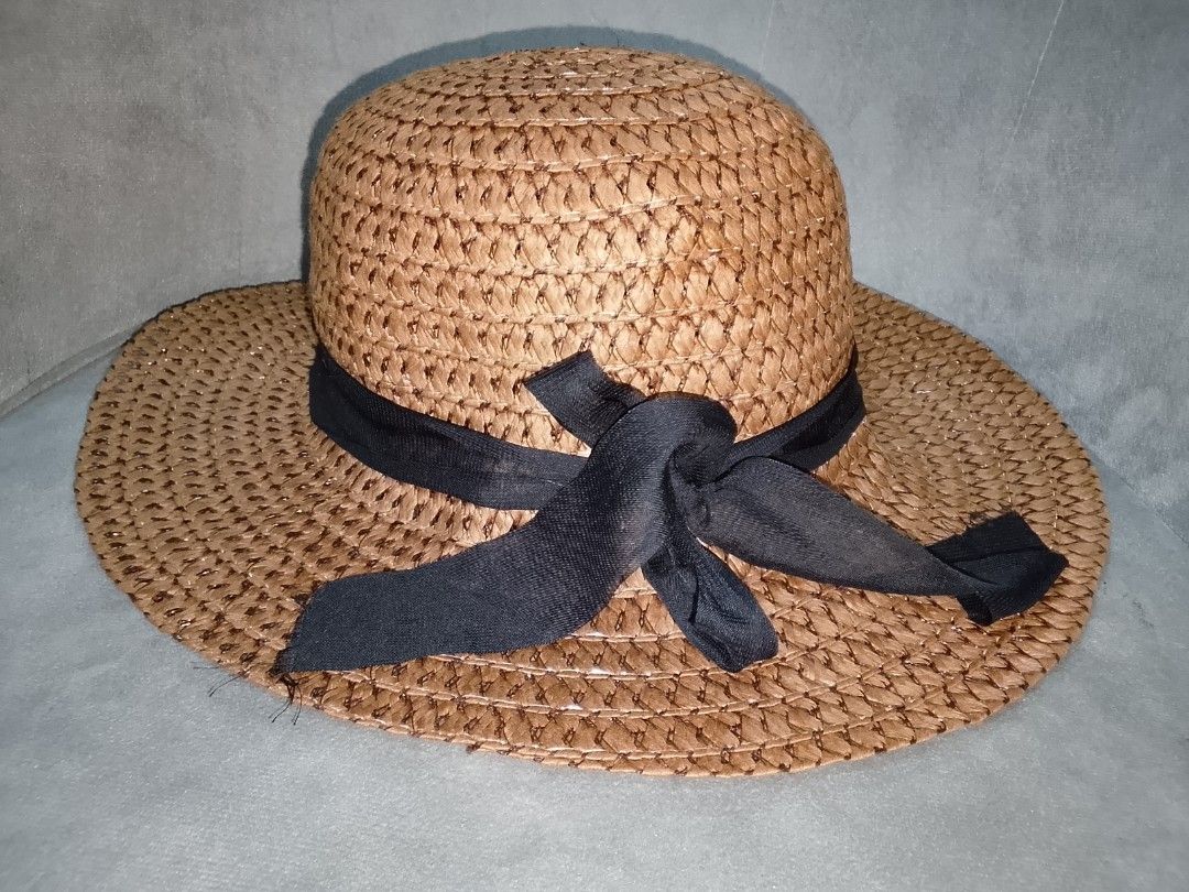 Woven Straw Sun Hat with Black Ribbon (Category: Hats & Beanies) located in Binangonan. Submitted by yuristalin888 (Listing ID 1453563054, Image 3). Description: - Classic woven straw sun hat - Features a simple black ribbon band - Wide brim offers excellent sun protection - Ideal for beach days, casual outings, or travel - Lightweight and easy to pack - Keeps the sun off your face and neck.