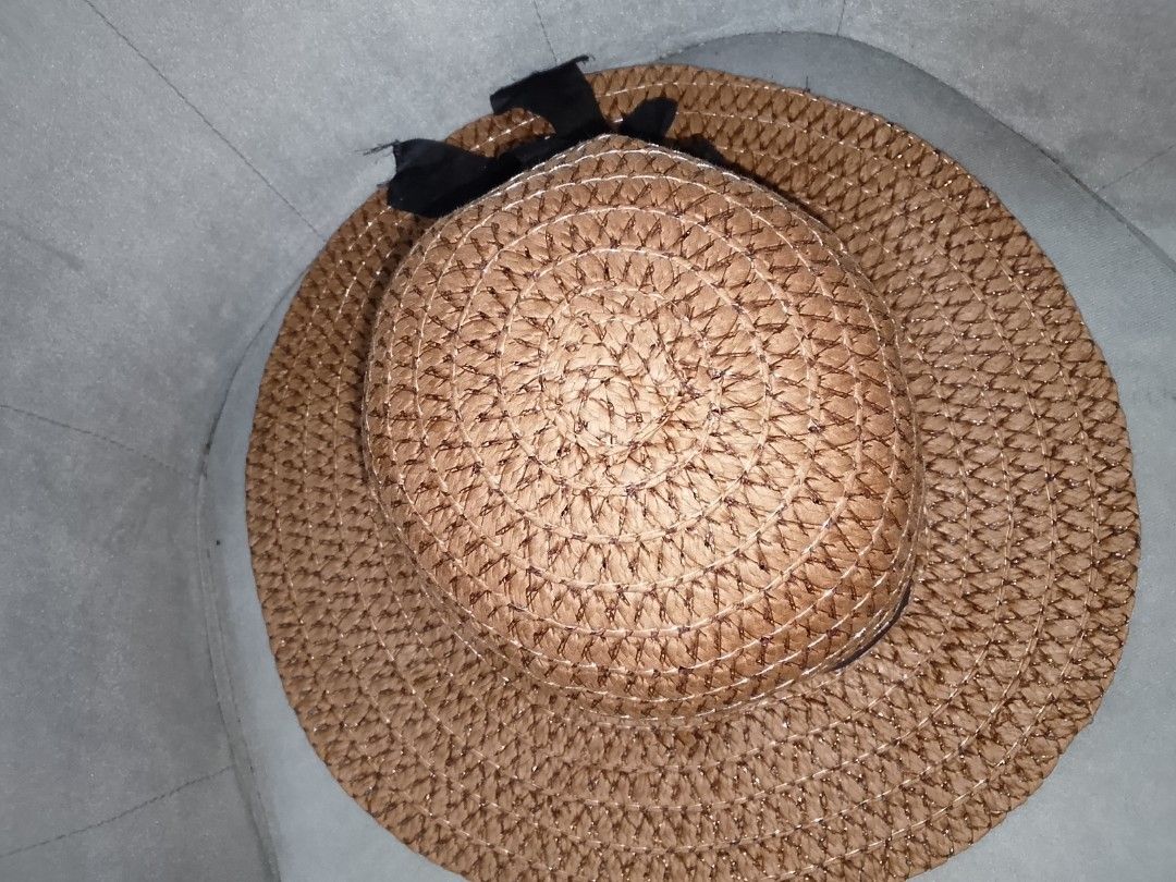 Woven Straw Sun Hat with Black Ribbon (Category: Hats & Beanies) located in Binangonan. Submitted by yuristalin888 (Listing ID 1453563054, Image 2). Description: - Classic woven straw sun hat - Features a simple black ribbon band - Wide brim offers excellent sun protection - Ideal for beach days, casual outings, or travel - Lightweight and easy to pack - Keeps the sun off your face and neck.