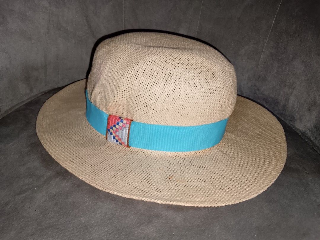 Woven Straw Sun Hat with Blue Ribbon (Category: Hats & Beanies) located in Binangonan. Submitted by yuristalin888 (Listing ID 1453453012, Image 2). Description: - Lightweight woven straw hat - Features a bright blue ribbon band - Wide brim for excellent sun protection - Blue interior lining - Ideal for beach days and summer outings - Easy to pack and wear.