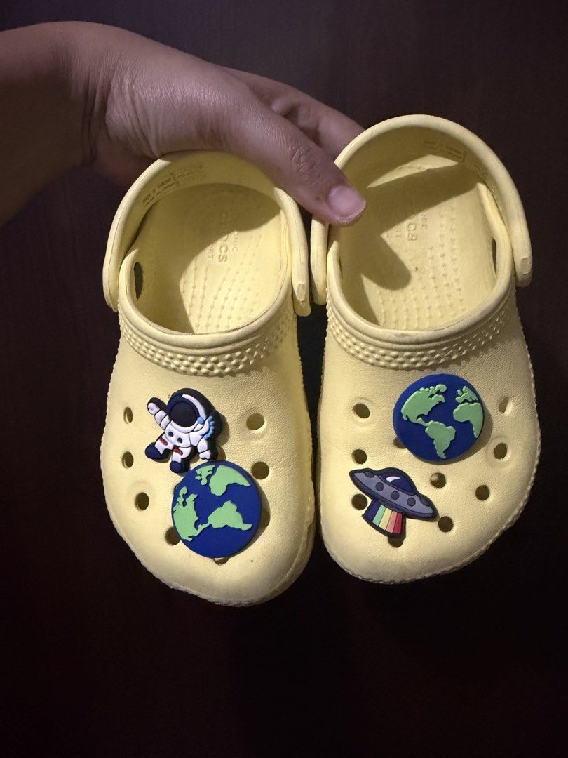Yellow Crocs with Space Charms - Size C7 (Category: Babies & Kids Fashion) located in Mandaluyong City. Submitted by jenvm (Listing ID 1453491771, Image 3). Description: - Yellow Crocs - Size 7 - Decorated with fun space-themed Jibbitz (planets, astronaut, UFO) - Great for casual wear or for kids who love space.