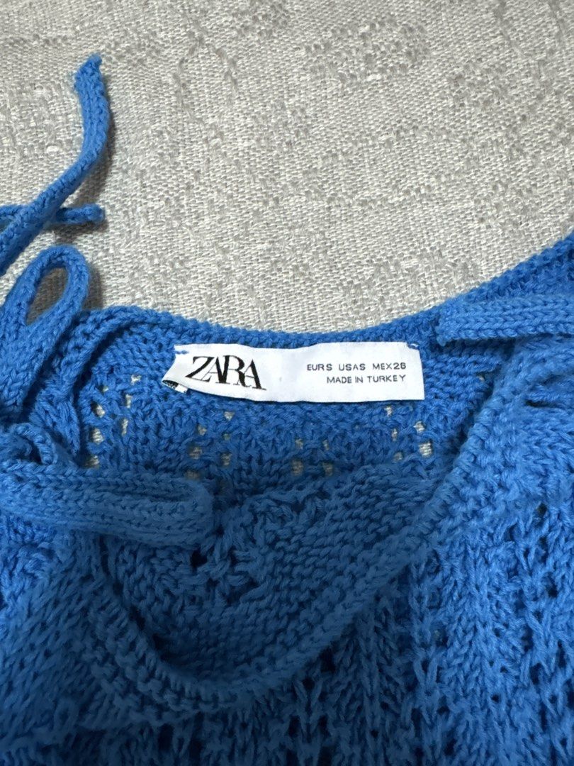 Zara Blue Knit Crochet Tie Strap Top (Category: Sleeveless) located in Mandaluyong City. Submitted by xxtin (Listing ID 1453545344, Image 2). Description: - Zara blue knit crochet top - Features tie shoulder straps - Scalloped hemline for a delicate finish.