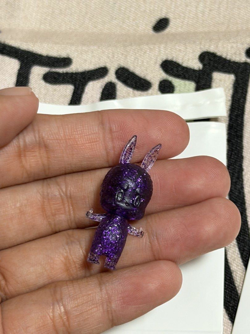 Zimomo Pop Bean (OG Design) (Category: Designer & Blind Box Toys) located in Manila. Submitted by jnndeclutter (Listing ID 1453581322, Image 2). Description: Zimomo Pop Bean Purple Glitter 2011 Manuf defect scratch on face.