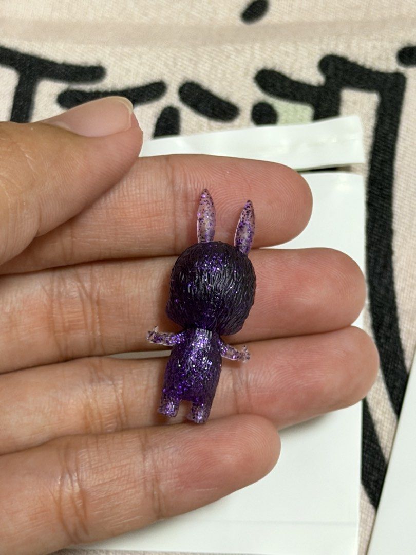 Zimomo Pop Bean (OG Design) (Category: Designer & Blind Box Toys) located in Manila. Submitted by jnndeclutter (Listing ID 1453581322, Image 3). Description: Zimomo Pop Bean Purple Glitter 2011 Manuf defect scratch on face.