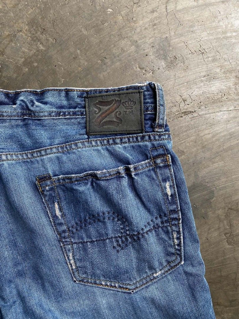Z.U.M. Jeans with Dragon Embroidery (Category: Jeans) located in Cabanatuan. Submitted by vivian_nicole_03 (Listing ID 1453537412, Image 3). Description: - Blue denim jeans - Unique dragon embroidery on back pocket - Distressed details on pockets and hem - Button and zip fly closure - Classic five-pocket design - Ideal for a stylish casual outfit.
