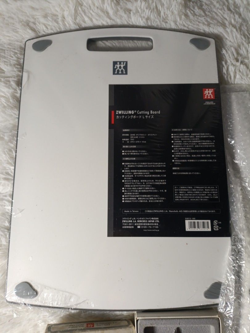 Zwilling J.A. Henckels Set (Category: Cookware & Accessories) located in Bacoor. Submitted by MommahAnnaOnlineShop (Listing ID 1453613917, Image 3). Description: - Genuine Zwilling J.A. Henckels kitchen set. - Includes a large cutting board. - Features a pair of red-handled kitchen shears. - Comes with additional knives (still in packaging). - Known for high quality and durability. - Zwilling J.A. Henckels Set Modern Cutting Board and Knife -Vint
