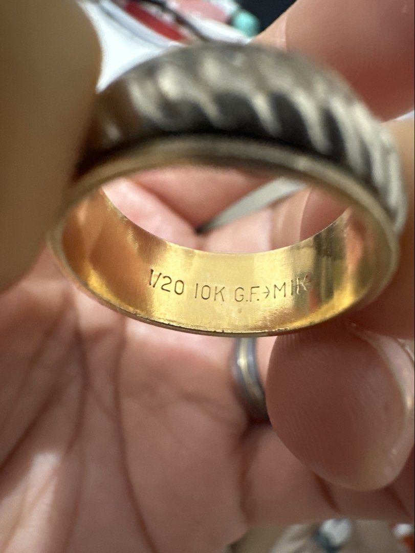 10K GF Spinner Ring (Category: Rings) located in Binan City. Submitted by maydenseven2006 (Listing ID 1458684716, Image 1). Description: - Gold tone spinner ring - Textured outer band - Stamped 1/20 10K G.F. MIK inside - Unique design - Perfect for fidgeting or as a stylish accessory.