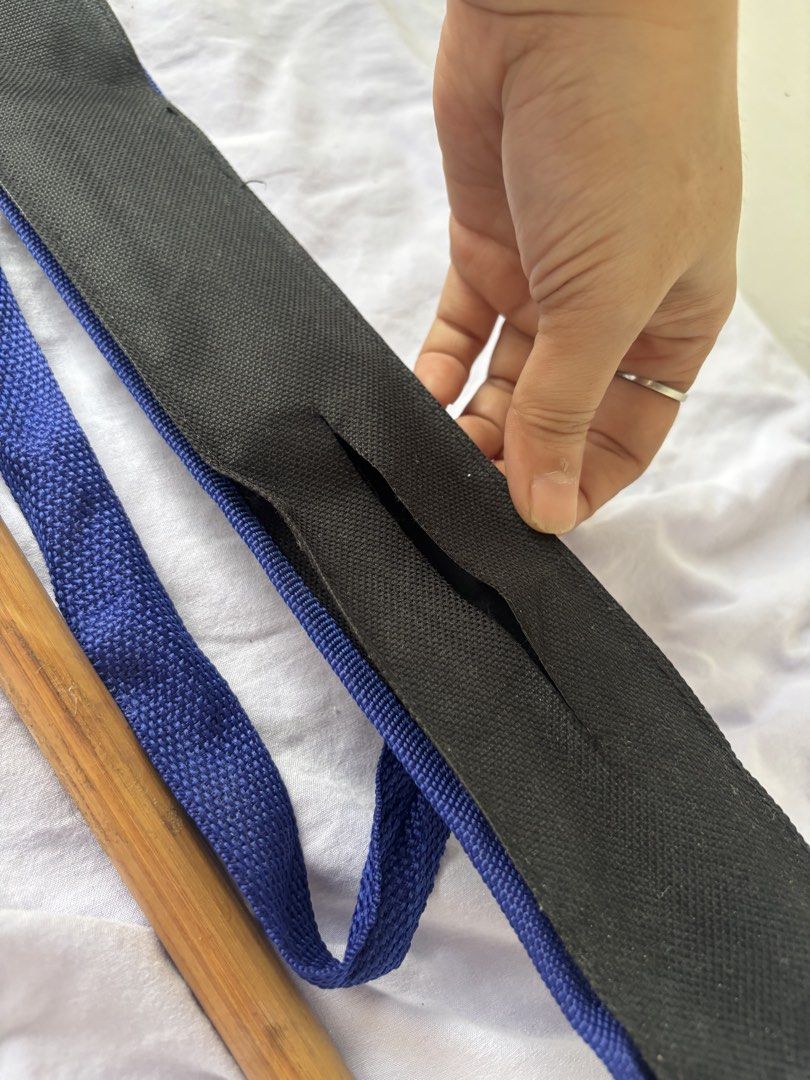 1pc Arnis Stick with Carrying Pouch (Category: Shoulder Bags) located in Paranaque City. Submitted by yanyannriley (Listing ID 1458565771, Image 2). Description: - Sturdy wooden arnis stick with a natural finish. - Comes with a convenient black and blue carrying pouch. - Pouch features a strap for easy transport. - Ideal for daily walks or as a unique prop..