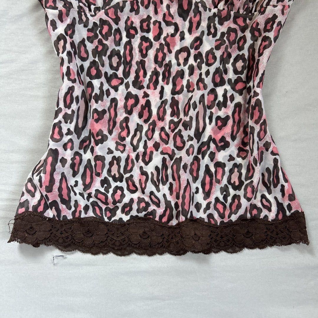 Accessorize Pink Leopard Lace Trim Cami Top (Category: Sleeveless) located in Davao. Submitted by read_my_abouts (Listing ID 1458532845, Image 3). Description: - Adorable pink leopard print camisole - Features delicate brown lace trim on neckline and hem - Sweet small pink bow accent at the front - Adjustable spaghetti straps for a perfect fit - Made from lightweight and flowy material - Versatile for layering or wearing solo.