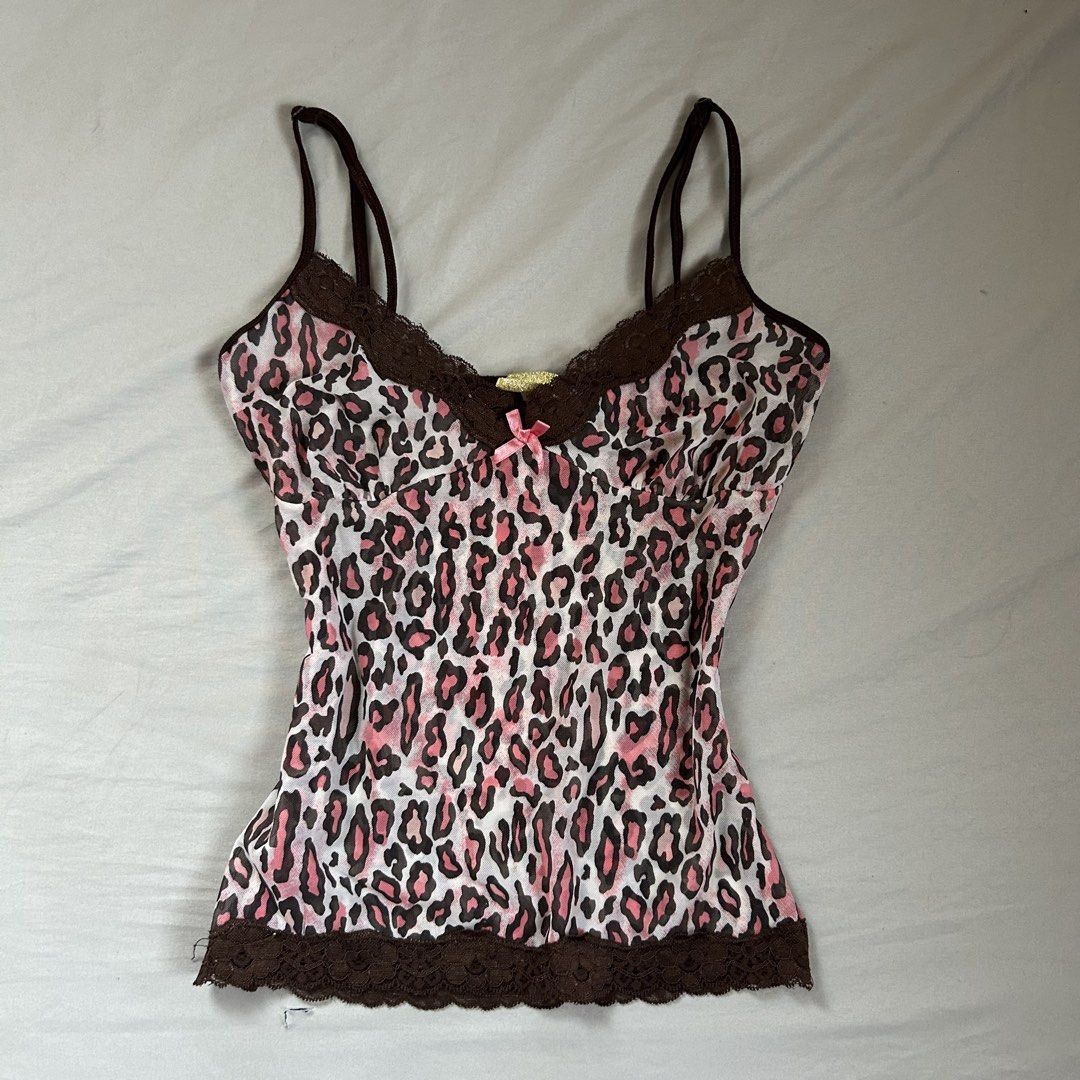 Accessorize Pink Leopard Lace Trim Cami Top (Category: Sleeveless) located in Davao. Submitted by read_my_abouts (Listing ID 1458532845, Image 1). Description: - Adorable pink leopard print camisole - Features delicate brown lace trim on neckline and hem - Sweet small pink bow accent at the front - Adjustable spaghetti straps for a perfect fit - Made from lightweight and flowy material - Versatile for layering or wearing solo.