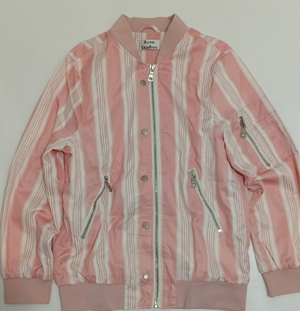 ACNE STUDIOS Pink White Striped Bomber Jacket (Category: Luxury Apparel) located in Navotas City. Submitted by ms.soulana (Listing ID 1454403329, Image 2). Description: PreOwned LikeNew Lightly Used Authentic 💗💗 Acne Studios Womens bomber jacket - Features pink and white vertical stripes - Zip-up front with snap button closure - Two zippered front pockets - Ribbed cuffs and hem for a snug fit - Ideal for stylish layering Size SMALL -Semi Large 