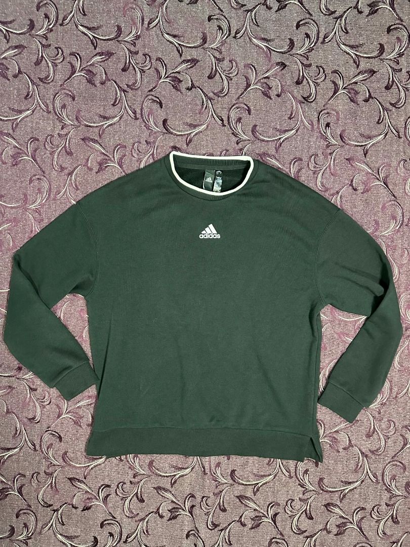 Adidas Black Center Logo Sweatshirt (Category: Coats, Jackets and Outerwear) located in Silang. Submitted by ws.thrift (Listing ID 1458649410, Image 1). Description: Details ⬇️ Price: ₱800 Adidas Black Center Logo Sweatshirt Color: Black Features: Center embroidered/printed Adidas Badge of Sport logo, white piping/trim on the crew neck collar, side slits at the hem, embroidered tonal logo on the upper back neck. Size Tag: Asia L / US M / KR 170/9