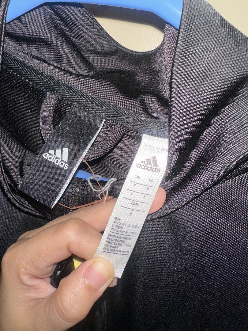 Adidas Track Jacket Black White Stripes (Category: Coats, Jackets and Outerwear) located in Manila. Submitted by chelseayb47224 (Listing ID 1458616572, Image 3). Description: - Classic Adidas track jacket - Used once - Has minimal frays in back portion (showed in listing images) - Black with iconic white sleeve stripes - Full zip front closure - Ribbed cuffs and hem for a snug fit - Crafted from recycled polyester - Versatile for sports or everyd