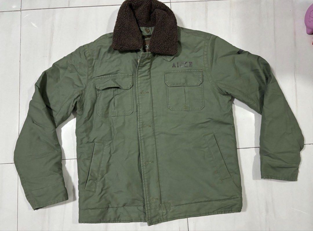 AIGLE Green Sherpa Lined Winter Jacket LARGE (Category: Coats, Jackets and Outerwear) located in Quezon City. Submitted by edether (Listing ID 1458653786, Image 1). Description: - Olive green AIGLE jacket - Cozy sherpa lining for warmth - Stylish faux fur collar - Secure button and zip closure - Convenient chest and side pockets - Ideal for colder weather - Classic workwear aesthetic Size Large Width - 24in Length- 28in Issue: faded logo on shoul