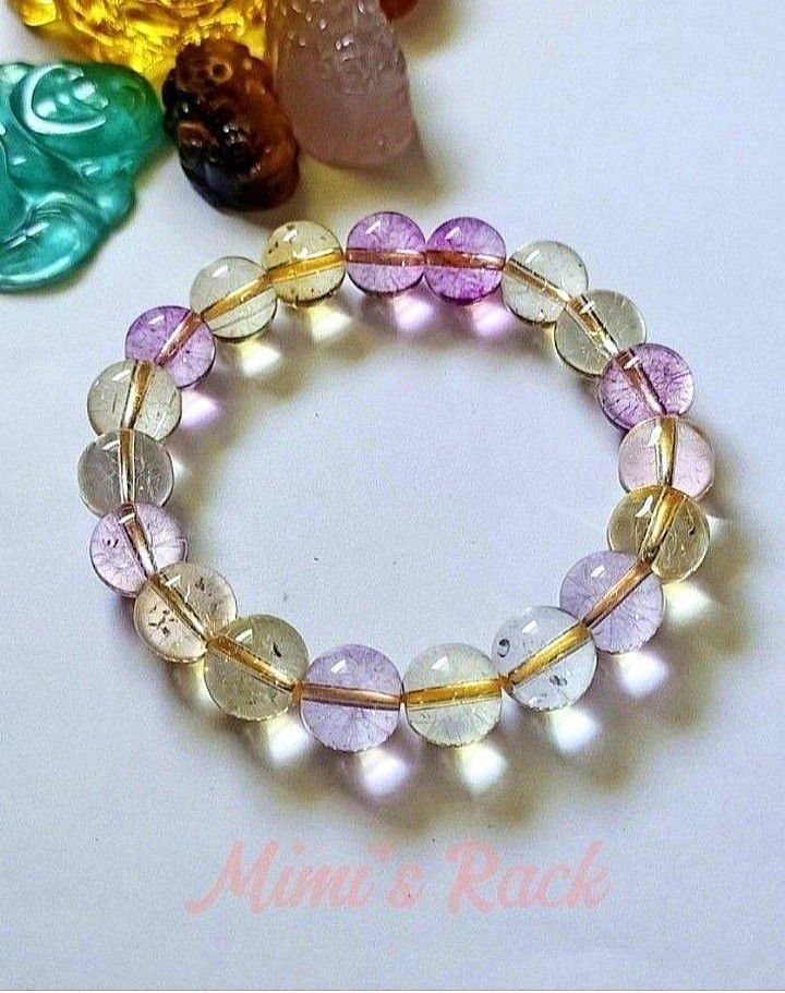 Ametrine Stone Bracelet (Category: Bracelets) located in Taguig. Submitted by mimisrack (Listing ID 1458675616, Image 2). Description: 💜💛A beautiful blend of calming amethyst and energizing citrine vibes -Ametrine is believed to help balance emotions, boost creativity, attract positivity, and support mental clarity and confidence - A dreamy gemstone bracelet with both calming and uplifting energy in one stunning piece 🧿 Bead size: 10mm 💎Gems 