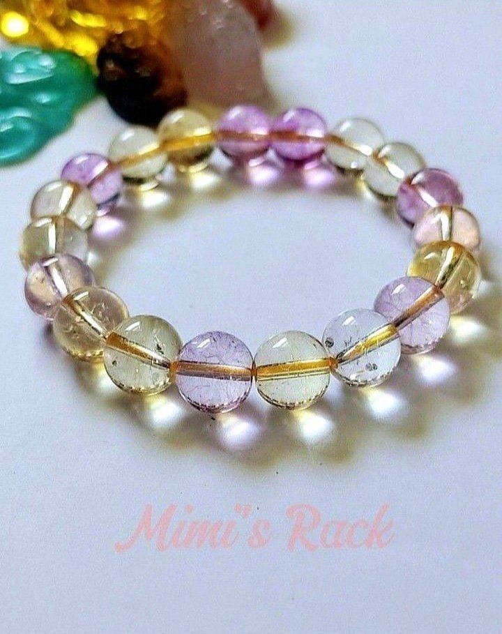 Ametrine Stone Bracelet (Category: Bracelets) located in Taguig. Submitted by mimisrack (Listing ID 1458675616, Image 1). Description: 💜💛A beautiful blend of calming amethyst and energizing citrine vibes -Ametrine is believed to help balance emotions, boost creativity, attract positivity, and support mental clarity and confidence - A dreamy gemstone bracelet with both calming and uplifting energy in one stunning piece 🧿 Bead size: 10mm 💎Gems 