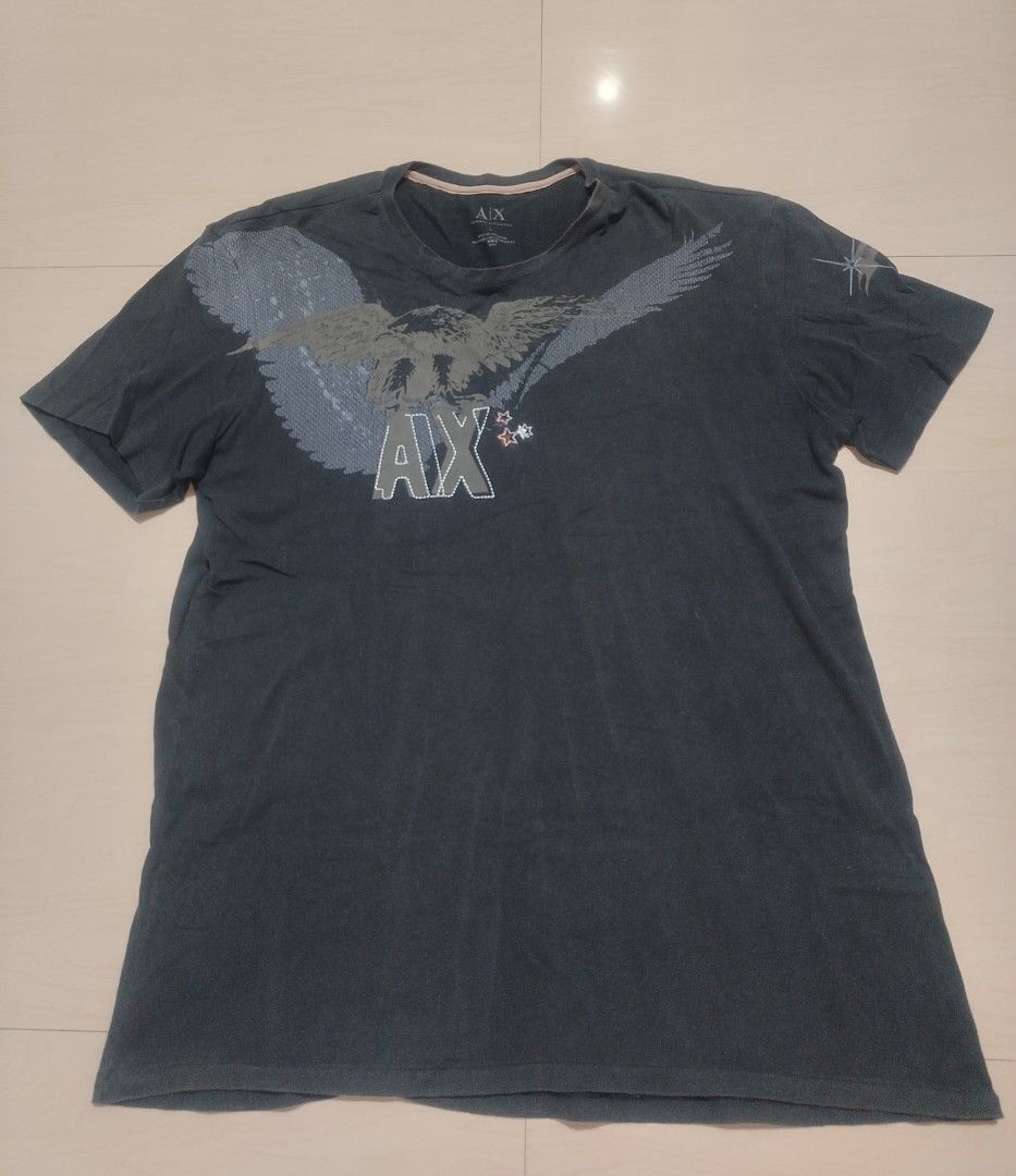 Armani Exchange Eagle Graphic T-Shirt (Category: Tshirts & Polo Shirts ) located in Tanza. Submitted by reddererd (Listing ID 1458650299, Image 1). Description: Width: 20.5 Length: 28.5 Color Rate: 7 Condition: 8 Issues: loose stitching on the bottom, altered collar 📌This item is thrifted and/or personally used, so please manage your expectations Mode of Payment: G Cash Mode of Delivery: J&T.