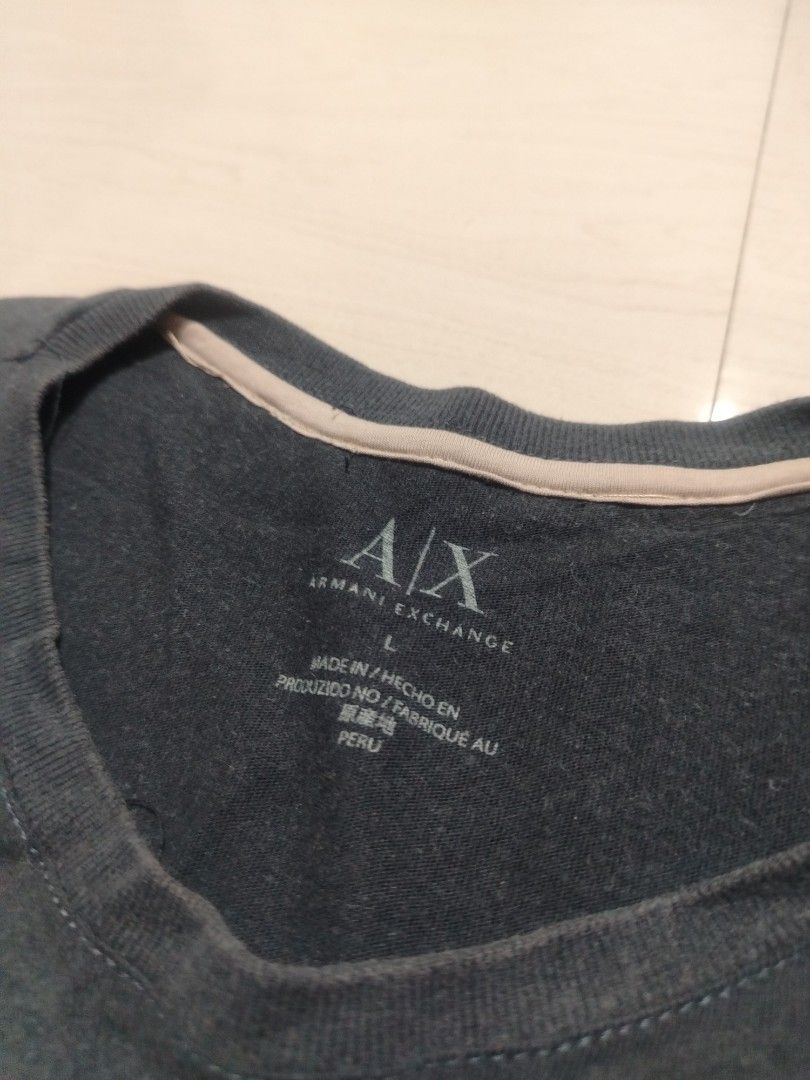 Armani Exchange Eagle Graphic T-Shirt (Category: Tshirts & Polo Shirts ) located in Tanza. Submitted by reddererd (Listing ID 1458650299, Image 3). Description: Width: 20.5 Length: 28.5 Color Rate: 7 Condition: 8 Issues: loose stitching on the bottom, altered collar 📌This item is thrifted and/or personally used, so please manage your expectations Mode of Payment: G Cash Mode of Delivery: J&T.