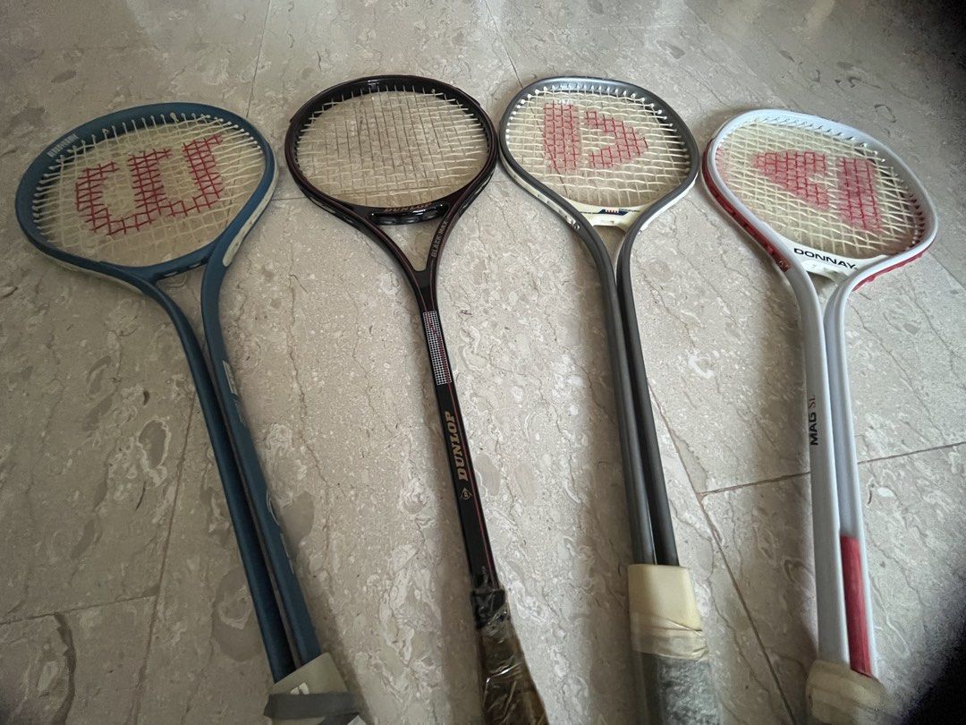 Assorted Squash rackets (Category: Racket & Ball Sports) located in Singapore. Submitted by jiafeng03 (Listing ID 1458570264, Image 1). Description: - Bundle of 4 tennis/squash rackets - Includes: 1xBlue Wilson Aerodynamic, 1xBlack Dunlop Black Max, 2xDonnay.