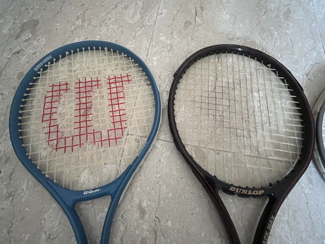 Assorted Squash rackets (Category: Racket & Ball Sports) located in Singapore. Submitted by jiafeng03 (Listing ID 1458570264, Image 3). Description: - Bundle of 4 tennis/squash rackets - Includes: 1xBlue Wilson Aerodynamic, 1xBlack Dunlop Black Max, 2xDonnay.