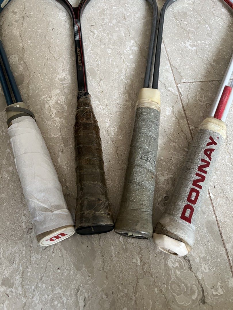 Assorted Squash rackets (Category: Racket & Ball Sports) located in Singapore. Submitted by jiafeng03 (Listing ID 1458570264, Image 2). Description: - Bundle of 4 tennis/squash rackets - Includes: 1xBlue Wilson Aerodynamic, 1xBlack Dunlop Black Max, 2xDonnay.