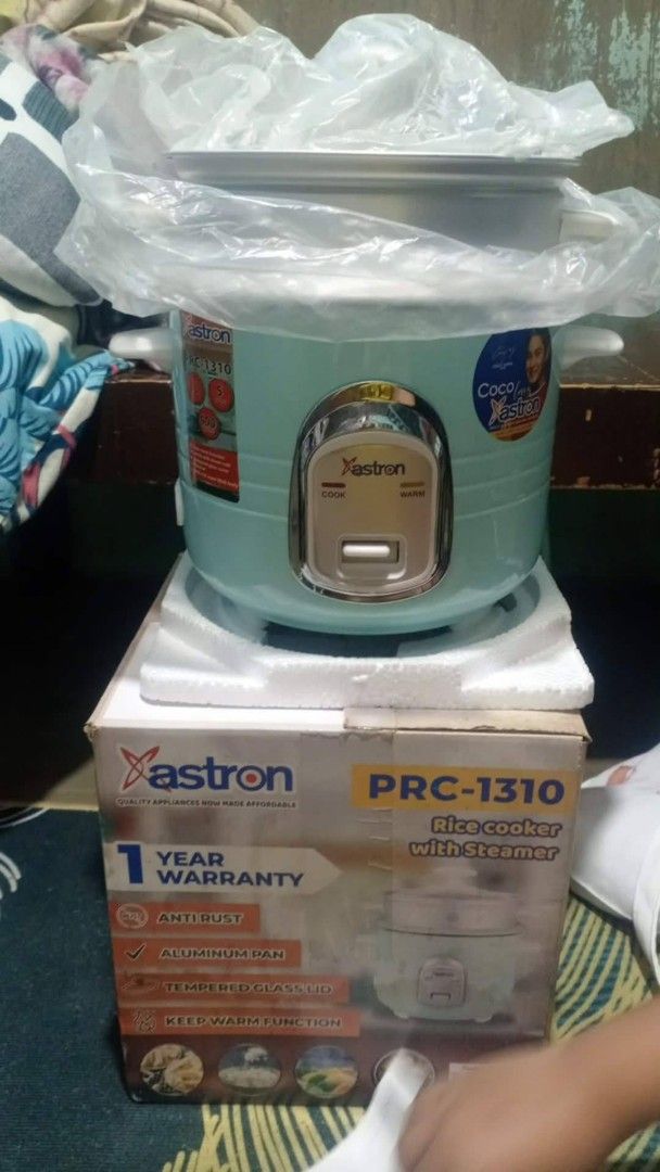 Astron PRC-1310 Rice Cooker with Steamer (Category: Cookers) located in Manila. Submitted by wisegem-231b (Listing ID 1458543436, Image 2). Description: - Astron Rice Cooker PRC-1310 - Color: Light Blue - Includes Steamer Basket - Anti-Rust Inner Pot - Keep Warm Function - 1-Year Warranty - Ideal for cooking rice and steaming food.