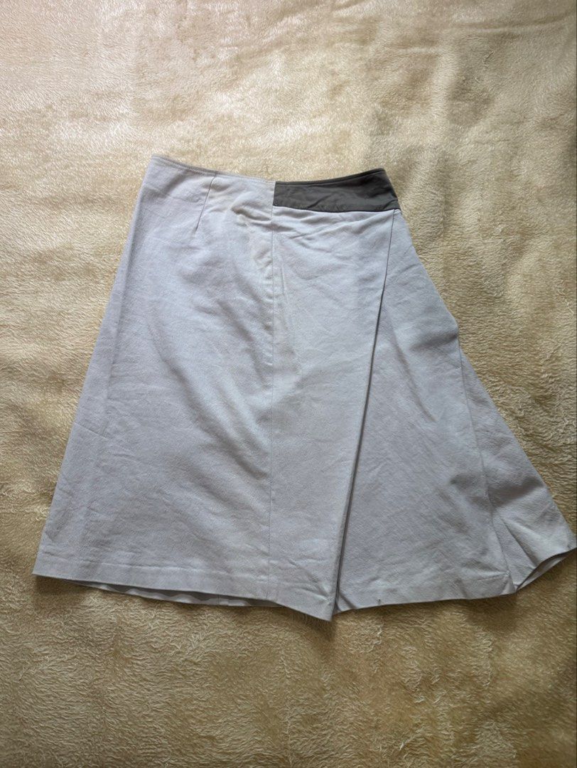 Asymmetrical Wrap Skirt with Pleats (Category: Skirts) located in Quezon City. Submitted by poch.queue (Listing ID 1458572021, Image 1). Description: - Light grey asymmetrical wrap skirt - Subtle pleat detail on the left side - Side Zipper, waistline 26-28 .