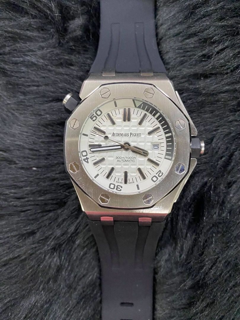 Audemars Piguet Royal Oak Automatic (Category: Luxury Watches) located in Caloocan City. Submitted by mrbigdreams (Listing ID 1458583308, Image 1). Description: - Audemars Piguet Royal Oak timepiece - Classic white dial with silver hands and markers - Reliable automatic movement - Impressive 300m (1000ft) water resistance, ideal for diving - Comfortable and durable black rubber strap - Versatile for both diving adventures and everyday elegance.