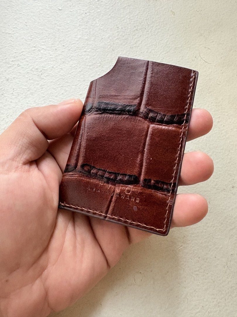 Authentic Fino Leatherware Croc-Embossed Card Holder (Category: Wallets & Card Holders) located in Mandaluyong City. Submitted by wear_your_style (Listing ID 1458544593, Image 2). Description: Store bought. Pinaglagyan lang ng spare card. Croc-embossed genuine leather. Maganda. Parang burgundy-brown ang color. Slim type so it can fit maybe 2-3 cards. Pero nag-eexpand pa yan in time. If you’re the type who don’t bring cash, perfect to for you. RFS
