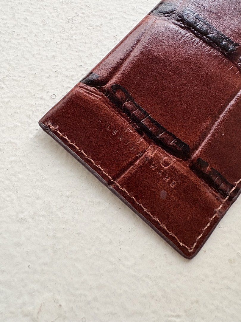 Authentic Fino Leatherware Croc-Embossed Card Holder (Category: Wallets & Card Holders) located in Mandaluyong City. Submitted by wear_your_style (Listing ID 1458544593, Image 3). Description: Store bought. Pinaglagyan lang ng spare card. Croc-embossed genuine leather. Maganda. Parang burgundy-brown ang color. Slim type so it can fit maybe 2-3 cards. Pero nag-eexpand pa yan in time. If you’re the type who don’t bring cash, perfect to for you. RFS