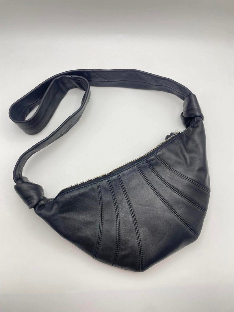 Authentic Lemaire croissant small black (Category: Cross-body Bags) located in Cagayan de Oro. Submitted by borse_de_amore (Listing ID 1458583721, Image 1). Description: Authentic Lemaire croissant small black Rank AB small stain inside. Exterior has minimal signs of use only barely visible. Fits long wallet, large fones and some. Retails for 77k bnew Selling super low. 10k only.