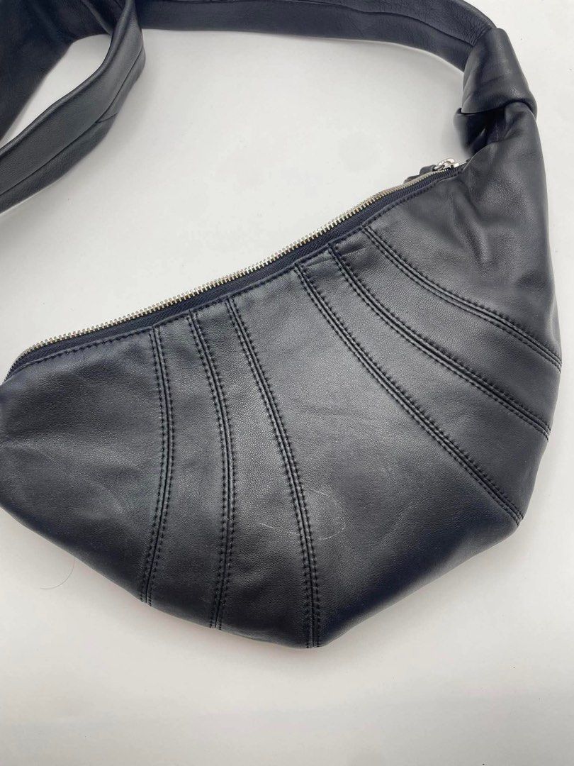 Authentic Lemaire croissant small black (Category: Cross-body Bags) located in Cagayan de Oro. Submitted by borse_de_amore (Listing ID 1458583721, Image 3). Description: Authentic Lemaire croissant small black Rank AB small stain inside. Exterior has minimal signs of use only barely visible. Fits long wallet, large fones and some. Retails for 77k bnew Selling super low. 10k only.