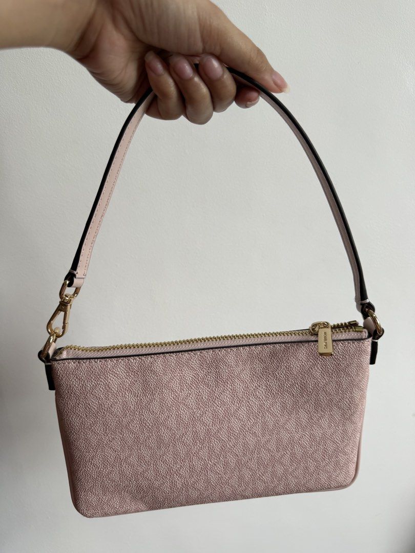 Authentic Michael Kors Pink Shoulder Bag (Category: Luxury Bags & Wallets) located in Batangas. Submitted by shopmystuff_ (Listing ID 1458511004, Image 3). Description: - Cute pink Michael Kors wristlet - All-over MK monogram pattern - Secure gold zipper closure - Detachable strap with gold clip - Small and compact, ideal for carrying essentials.