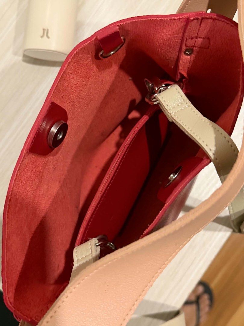 Aztrid Lulu Bag (Category: Cross-body Bags) located in Manila. Submitted by joshtoleds (Listing ID 1458555291, Image 3). Description: - Cute red leather bucket bag - Secure drawstring closure - Versatile carrying options: long adjustable strap and shorter top handles - Convenient interior slip pockets - Ideal for everyday use - Chic minimalist design Super mint condition. Price is negotiable Loc: Bacoor, Cavite/Manila.