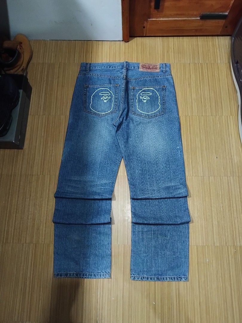 BAPE A Bathing Ape Denim Jeans Ape Head Logo (Category: Jeans) located in Manila. Submitted by unghettoboysclub (Listing ID 1458622249, Image 1). Description: - Brand: BAPE -Dimensions: W:37 L:45.5 T:13.5 H:9 - Type: Blue Denim Jeans - Size: Tagged XL - Features: Iconic Ape Head logo embroidered on back pockets - Fit: Classic straight leg - Style: Ideal for streetwear collections.