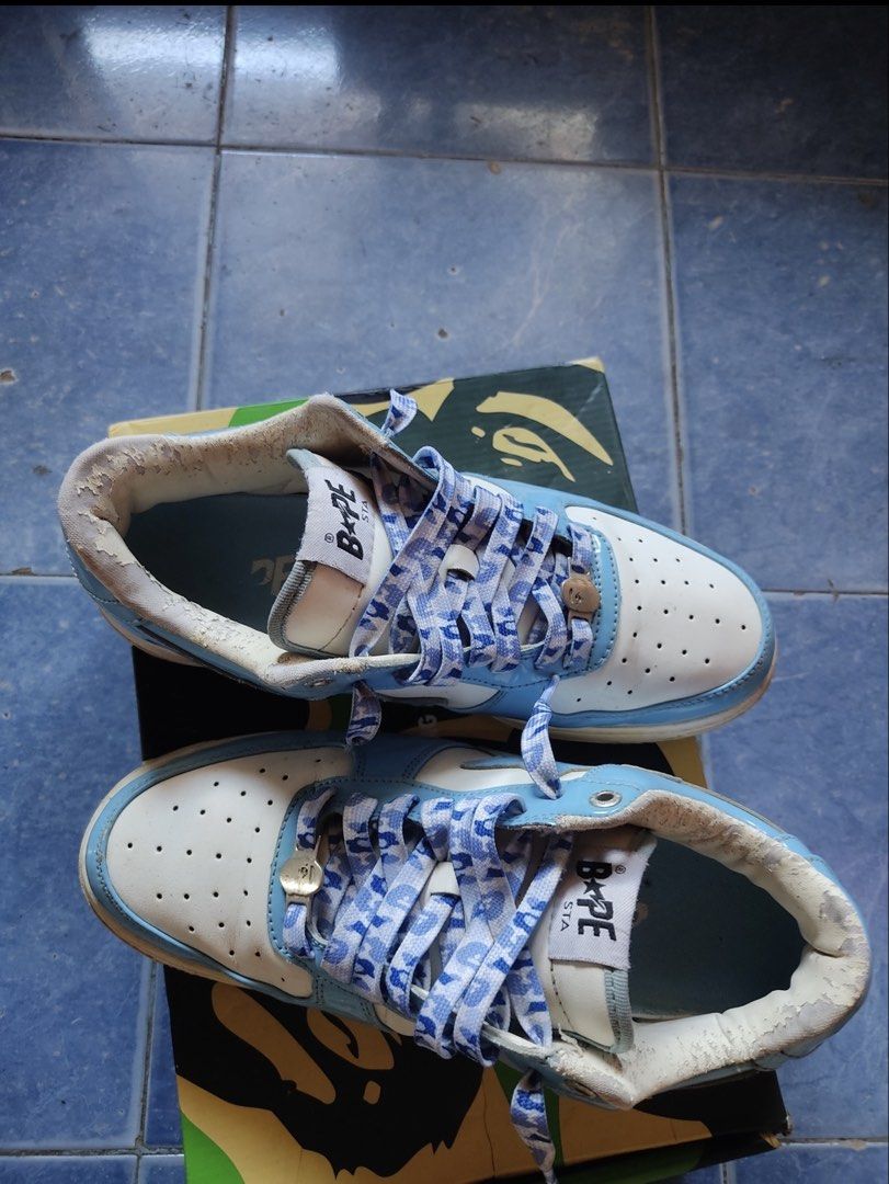 BAPE STA Low Light Blue White (Category: Sneakers) located in Angeles City. Submitted by kielsthrift (Listing ID 1458544647, Image 2). Description: - BAPE STA Low sneakers - Color: Light Blue and White - Features classic BAPE star logo - Laces have unique BAPE pattern - Comes with original box - Authentic and stylish footwear.