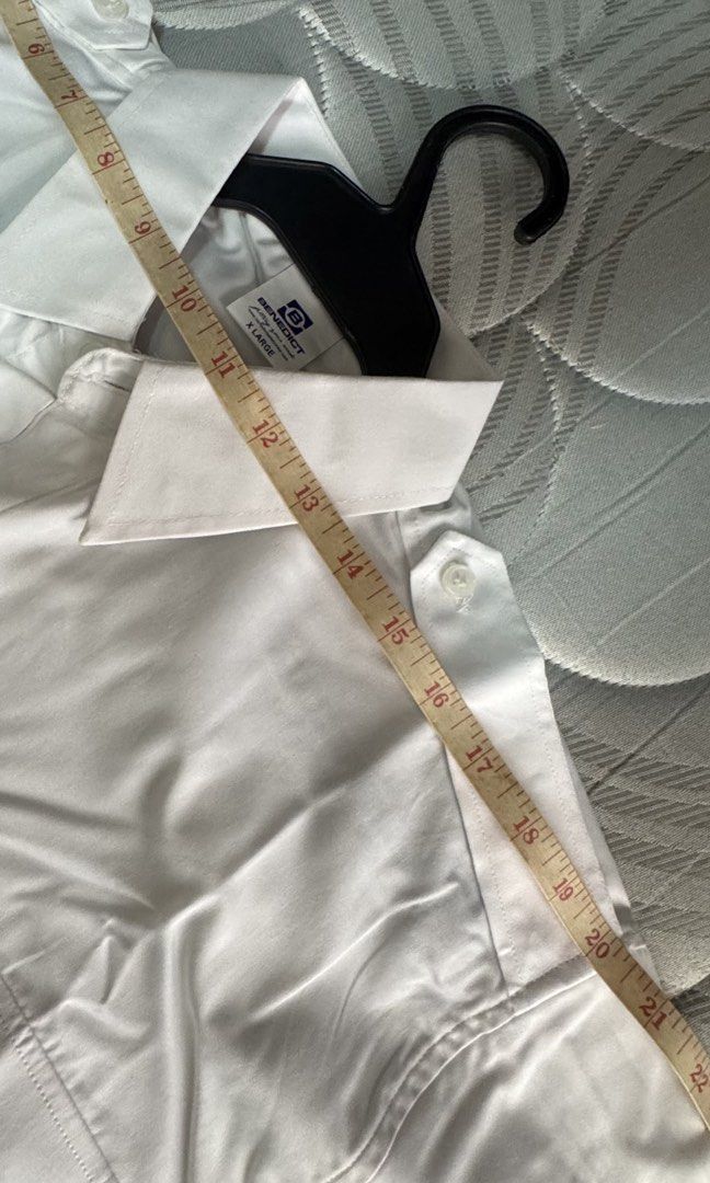 Benedict White Short Sleeve Button Up Shirt (Category: Shirts) located in Bacoor. Submitted by _ibyangf (Listing ID 1458601552, Image 3). Description: - Brand: Benedict - Color: White - Style: Short sleeve button-up shirt - Features: Two chest pockets with button closure, shoulder epaulets - Measurements on the photos - Versatile: Suitable for work or casual wear I have 5 of these, all brand new, same size XL J&T Delivery Gcash/Maya payment.