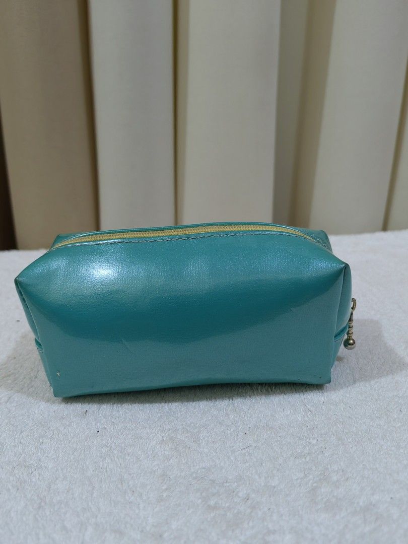 BEVEL Teal Pouch (Category: Purses & Pouches) located in Makati City. Submitted by prelovedtreatedwithlove (Listing ID 1458602703, Image 3). Description: - Teal colored mini pouch or coin purse by BEVEL - Secure zipper closure - Compact size, ideal for makeup or small essentials or coin purse too - Interior is clean and well-maintained -no issue. - Cute for coin purse .