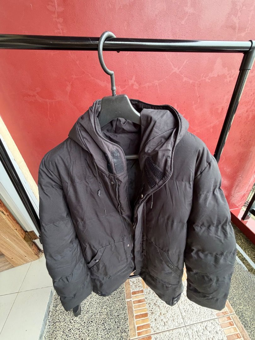 Black Hooded Puffer Winter Jacket (Category: Coats, Jackets and Outerwear) located in Manila. Submitted by transbox (Listing ID 1458545676, Image 3). Description: - Black puffer jacket - Hooded design - Zip and snap button closure - Two front pockets - Perfect for staying warm - Fits approximately Men's Large / XL; measures ~23.5–24 inches pit-to-pit, ~18–19 inches shoulder width, and ~35 inches in total length - Please check photos for condition